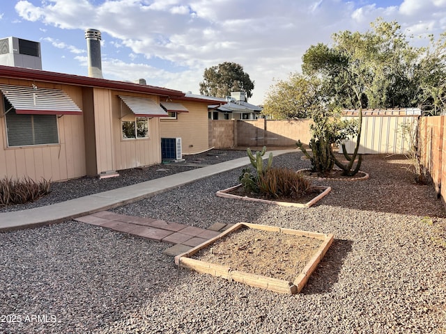 view of yard featuring a fenced backyard and cooling unit