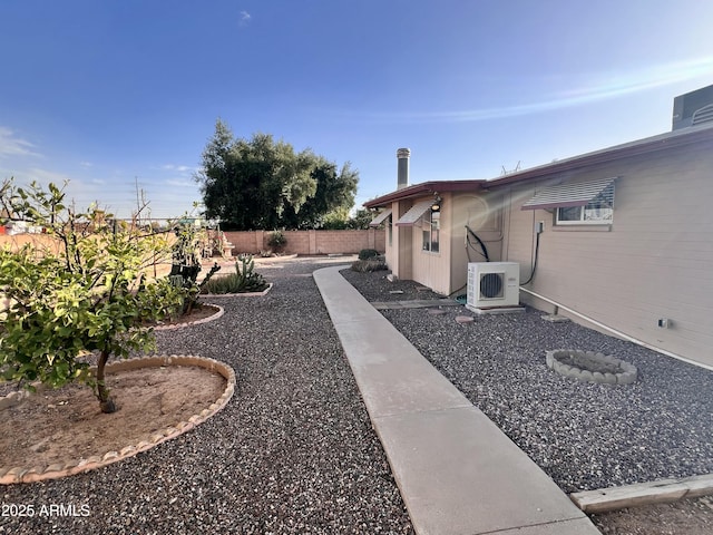 view of yard with ac unit, a patio area, and a fenced backyard