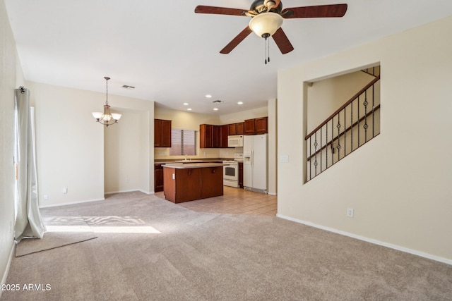 unfurnished living room featuring light carpet and ceiling fan with notable chandelier