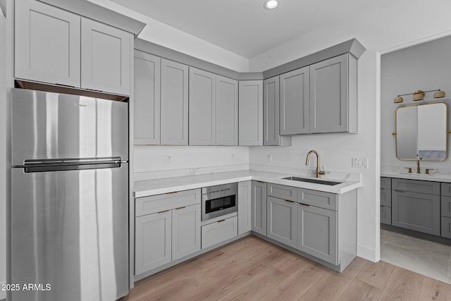 34198 S State Route 89th Hwy, Wickenburg, AZ 85390 - kitchen featuring stainless steel appliances, gray cabinetry, a sink, and recessed lighting