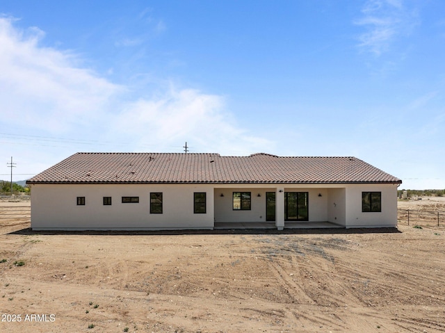 34198 S State Route 89th Hwy, Wickenburg, AZ 85390 - back of house with a patio area, a tiled roof, and stucco siding