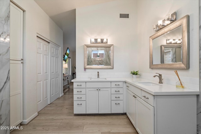 13361 N 99th Pl, Scottsdale, AZ 85260 - full bathroom with double vanity and wood finished floors