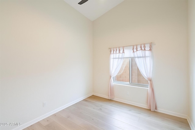 13361 N 99th Pl, Scottsdale, AZ 85260 - empty room with light wood-style flooring, lofted ceiling, a ceiling fan, and baseboards