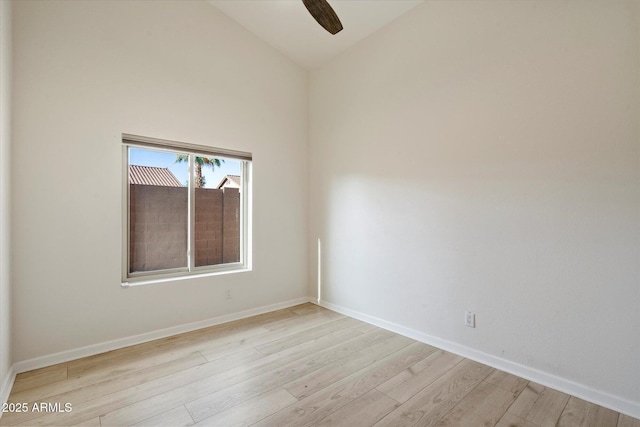 13361 N 99th Pl, Scottsdale, AZ 85260 - empty room with light wood finished floors, baseboards, high vaulted ceiling, and a ceiling fan