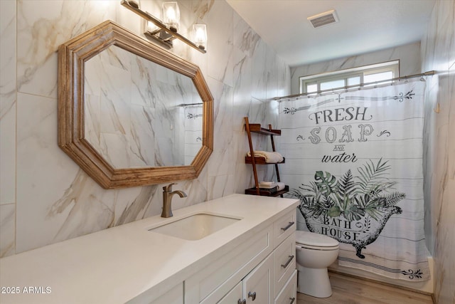 13361 N 99th Pl, Scottsdale, AZ 85260 - bathroom featuring toilet, tile walls, vanity, a shower with shower curtain, and wood finished floors