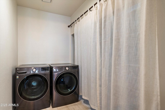 13361 N 99th Pl, Scottsdale, AZ 85260 - laundry area featuring washing machine and dryer and wood finished floors