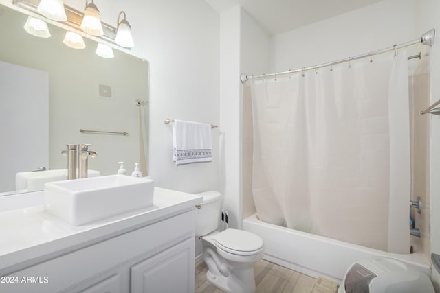 full bathroom featuring vanity, toilet, shower / tub combo, and hardwood / wood-style floors