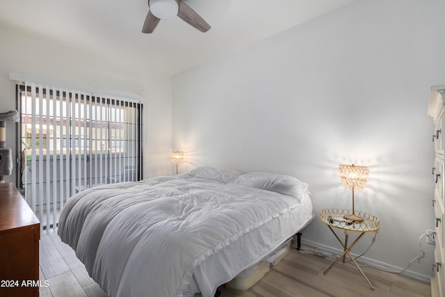 bedroom with ceiling fan, light hardwood / wood-style floors, and access to outside