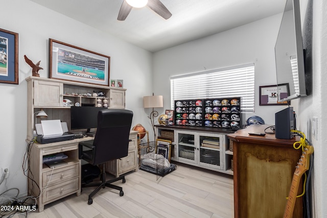 office with ceiling fan and light wood-type flooring