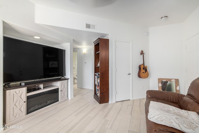 living room with light hardwood / wood-style flooring