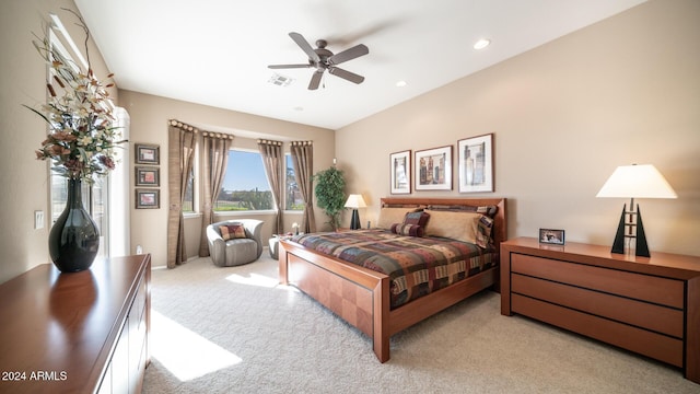 bedroom featuring light carpet and ceiling fan