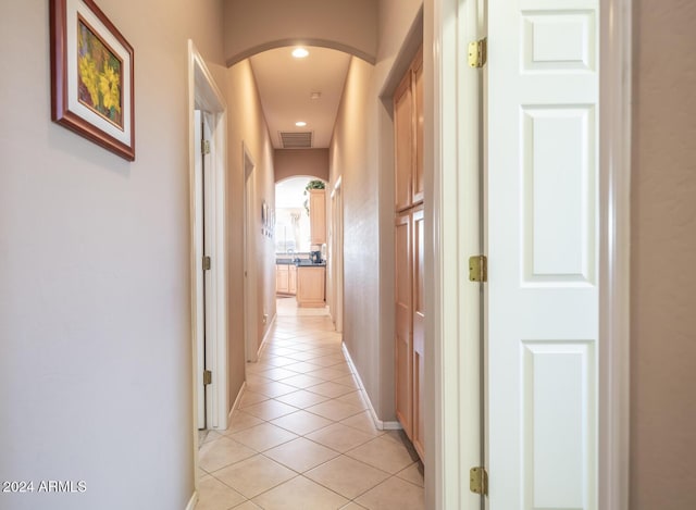 hall with light tile patterned flooring