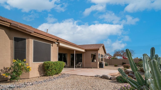 rear view of house with a patio