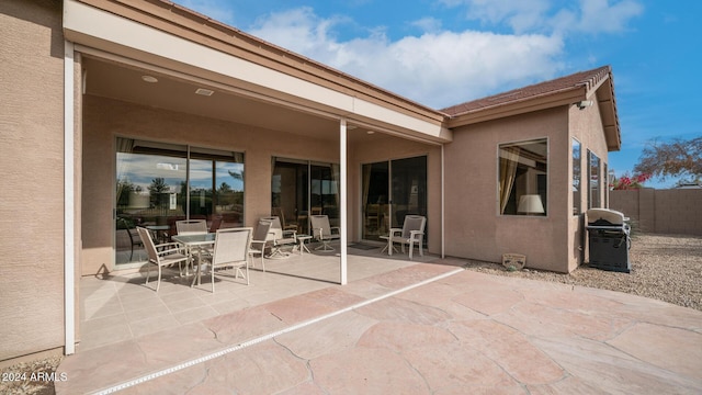 back of house with a patio