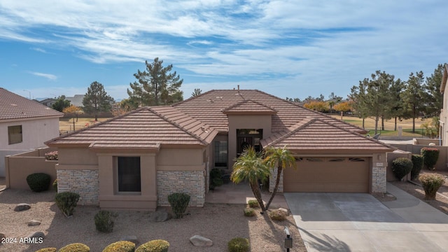 view of front of property with a garage