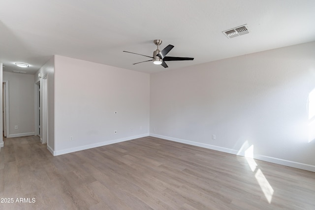 unfurnished room with ceiling fan and light hardwood / wood-style flooring