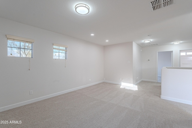 spare room with light colored carpet