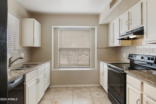 kitchen featuring white cabinets, light tile patterned floors, sink, black appliances, and tasteful backsplash