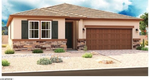 view of front of home featuring a garage, stone siding, and decorative driveway