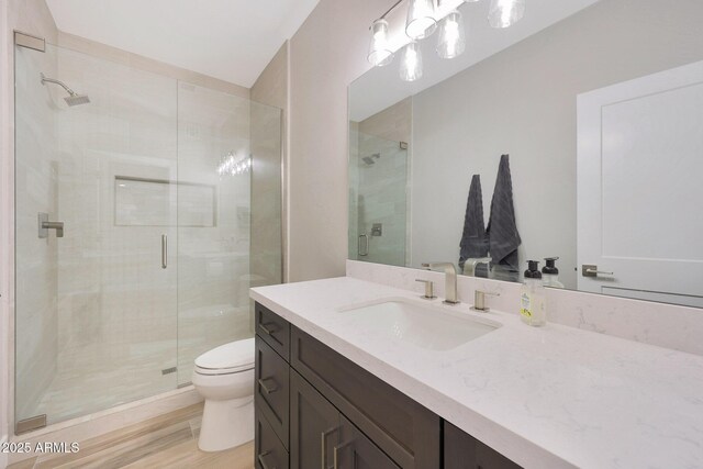4040 E Mclellan Rd Unit 16, Mesa, AZ 85205 - bathroom featuring vanity, a shower stall, and wood finished floors