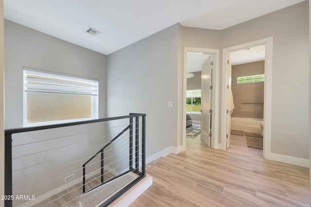 4040 E Mclellan Rd Unit 16, Mesa, AZ 85205 - hallway featuring light wood-style flooring and an upstairs landing