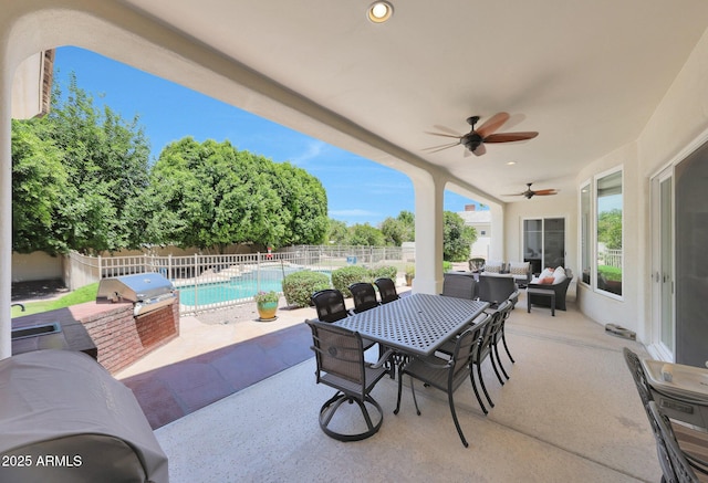 4040 E Mclellan Rd Unit 16, Mesa, AZ 85205 - fenced backyard featuring a patio area, a ceiling fan, outdoor dining area, and an outdoor kitchen