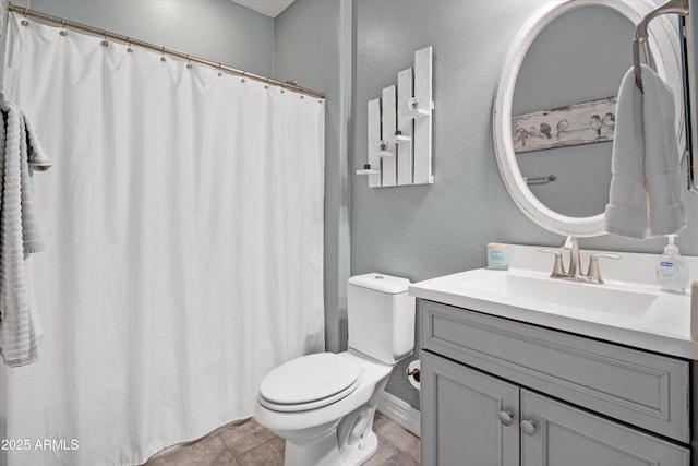 bathroom with tile patterned flooring, vanity, baseboards, toilet, and a shower with shower curtain
