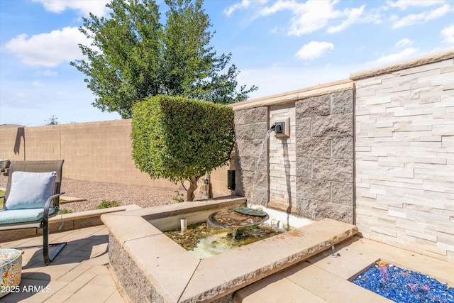 view of patio / terrace with fence