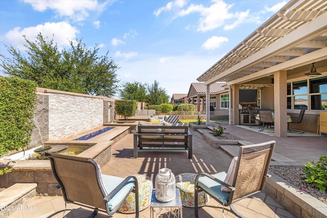view of patio featuring an outdoor living space with a fire pit