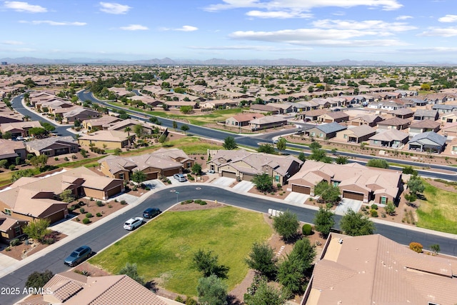 drone / aerial view featuring a residential view and a mountain view