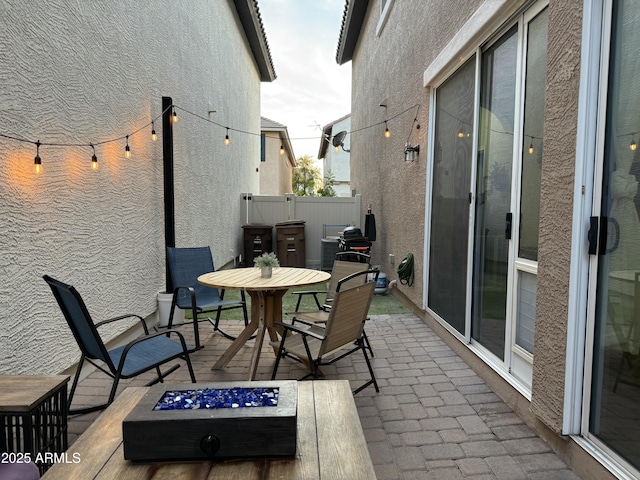 view of patio / terrace featuring outdoor dining space and fence