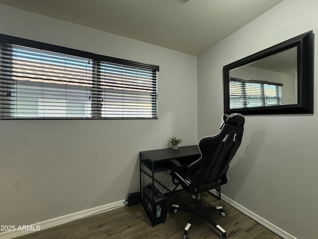 home office with wood finished floors, baseboards, and a textured ceiling