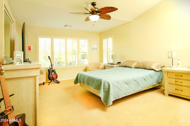 carpeted bedroom with ceiling fan