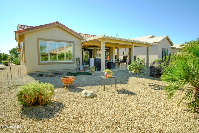 rear view of house featuring a patio