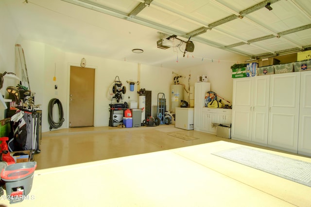 garage featuring a garage door opener and water heater