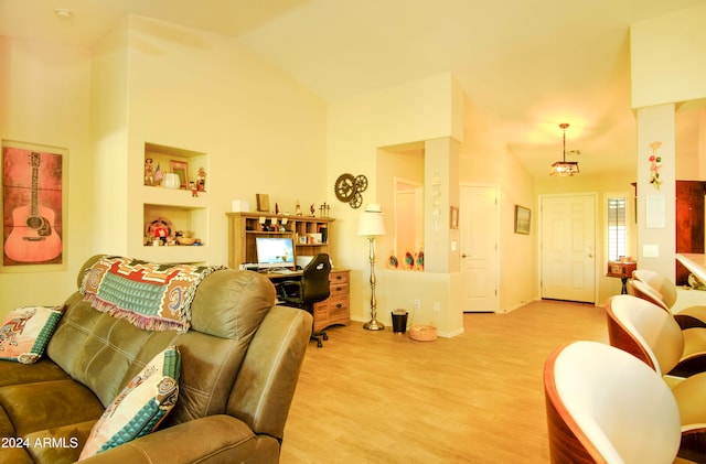 living room featuring light hardwood / wood-style floors and lofted ceiling