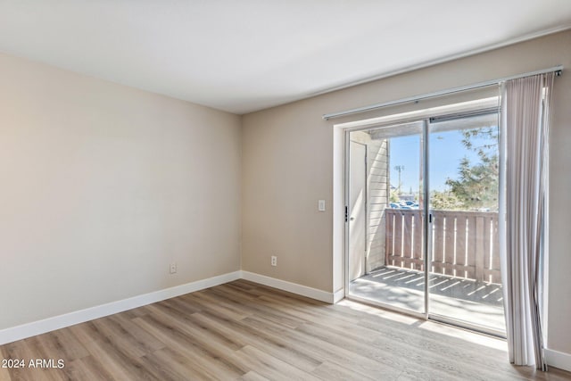 spare room featuring light wood-type flooring