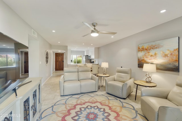 living room with ceiling fan