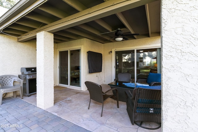 view of patio / terrace featuring ceiling fan and grilling area