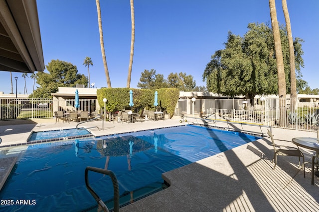 view of swimming pool featuring a patio