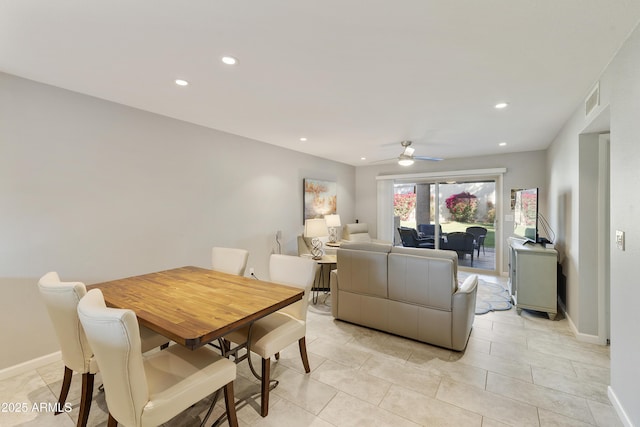 dining room with ceiling fan and light tile patterned floors