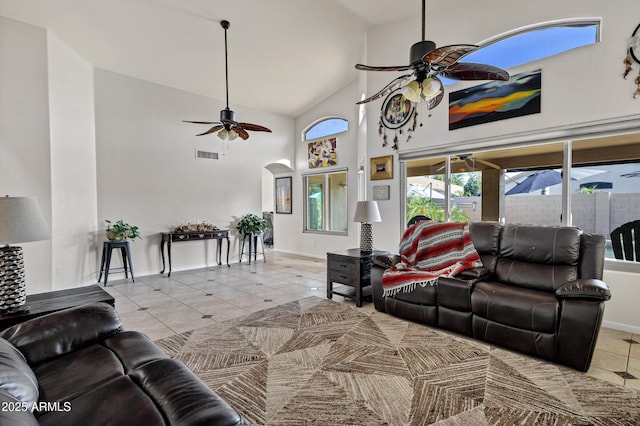 4493 E Desert Sands Dr, Chandler, AZ 85249 - tiled living area with a ceiling fan, arched walkways, and high vaulted ceiling