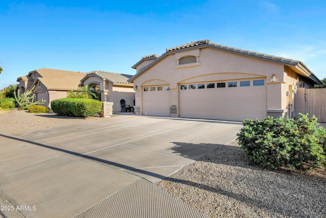 4493 E Desert Sands Dr, Chandler, AZ 85249 - mediterranean / spanish house featuring stucco siding, concrete driveway, a tile roof, and a garage