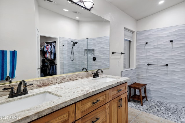 4493 E Desert Sands Dr, Chandler, AZ 85249 - bathroom with double vanity, walk in shower, tile patterned floors, a spacious closet, and recessed lighting