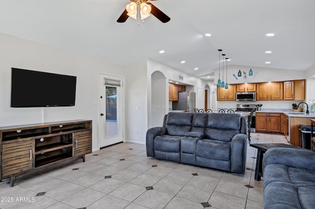 4493 E Desert Sands Dr, Chandler, AZ 85249 - living room featuring vaulted ceiling, arched walkways, a ceiling fan, light tile patterned flooring, and recessed lighting