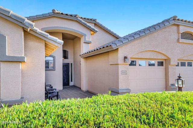 4493 E Desert Sands Dr, Chandler, AZ 85249 - doorway to property featuring a tile roof and stucco siding
