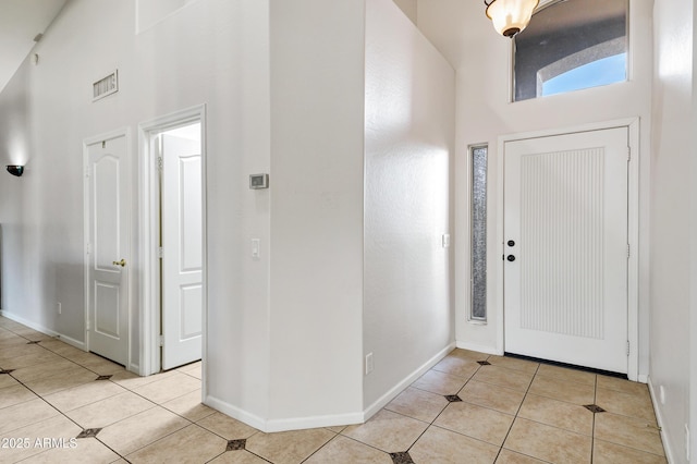 4493 E Desert Sands Dr, Chandler, AZ 85249 - foyer with a high ceiling, light tile patterned floors, and baseboards