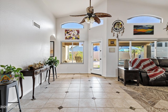 4493 E Desert Sands Dr, Chandler, AZ 85249 - foyer entrance featuring a ceiling fan, baseboards, high vaulted ceiling, arched walkways, and light tile patterned flooring