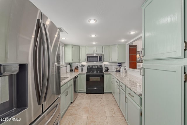 kitchen featuring light tile patterned floors, tasteful backsplash, visible vents, light stone counters, and stainless steel appliances