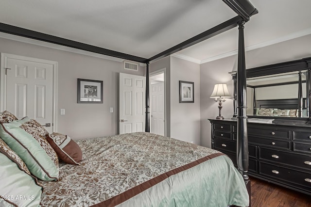 bedroom featuring dark wood-type flooring, visible vents, and crown molding